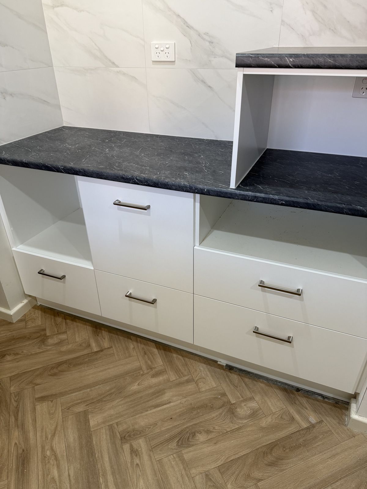 Built in cabinetry with stone benchtop and custom internals